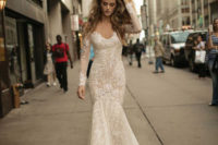 04 Mermaid illusion shoulder sparkling gown with a deep V neckline and lace appliques