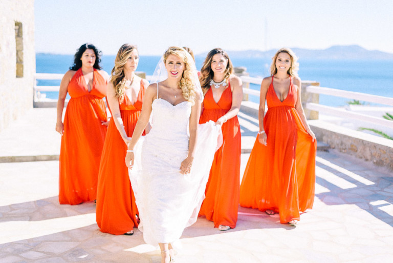 The bridesmaids were rocking bold orange maxi gowns