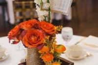 04 a crate with bold orange and red blooms, glittered vases