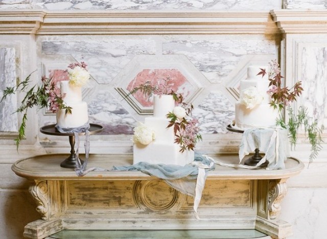 The assortment of wedding cakes was in white, with leaves and peonies