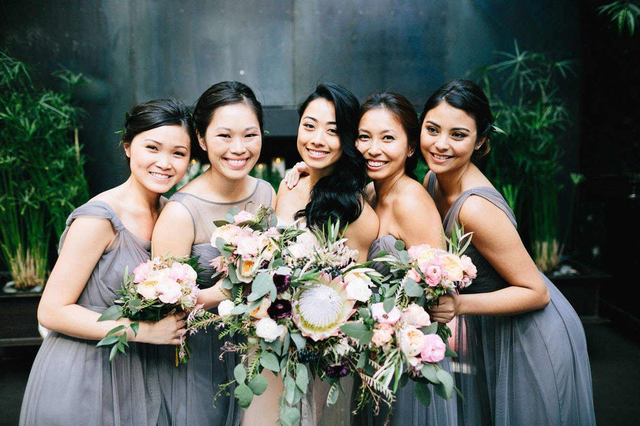 The bridesmaids were wearing mismatched charcoal dresses