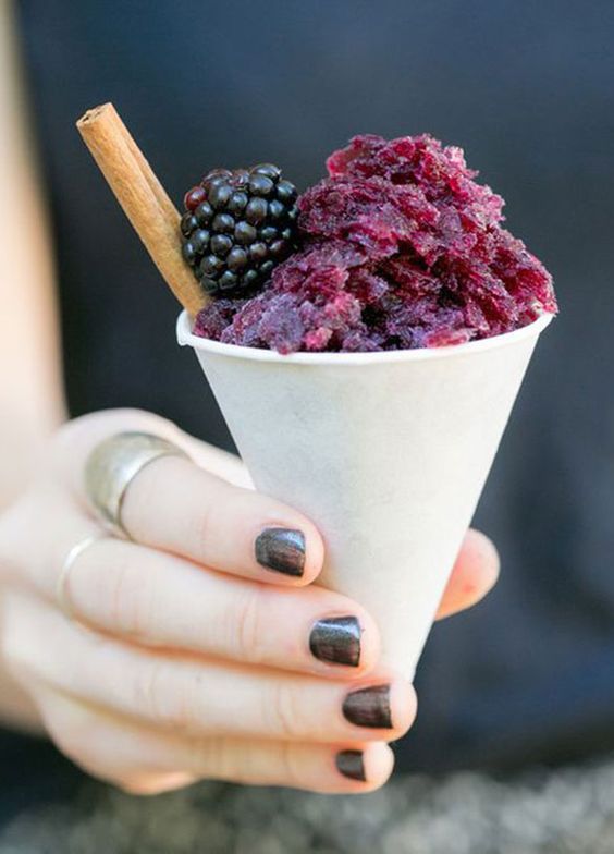 sangria snow cone with a blackberry for refreshing