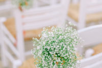 06 The chairs were decorated with baby’s breath