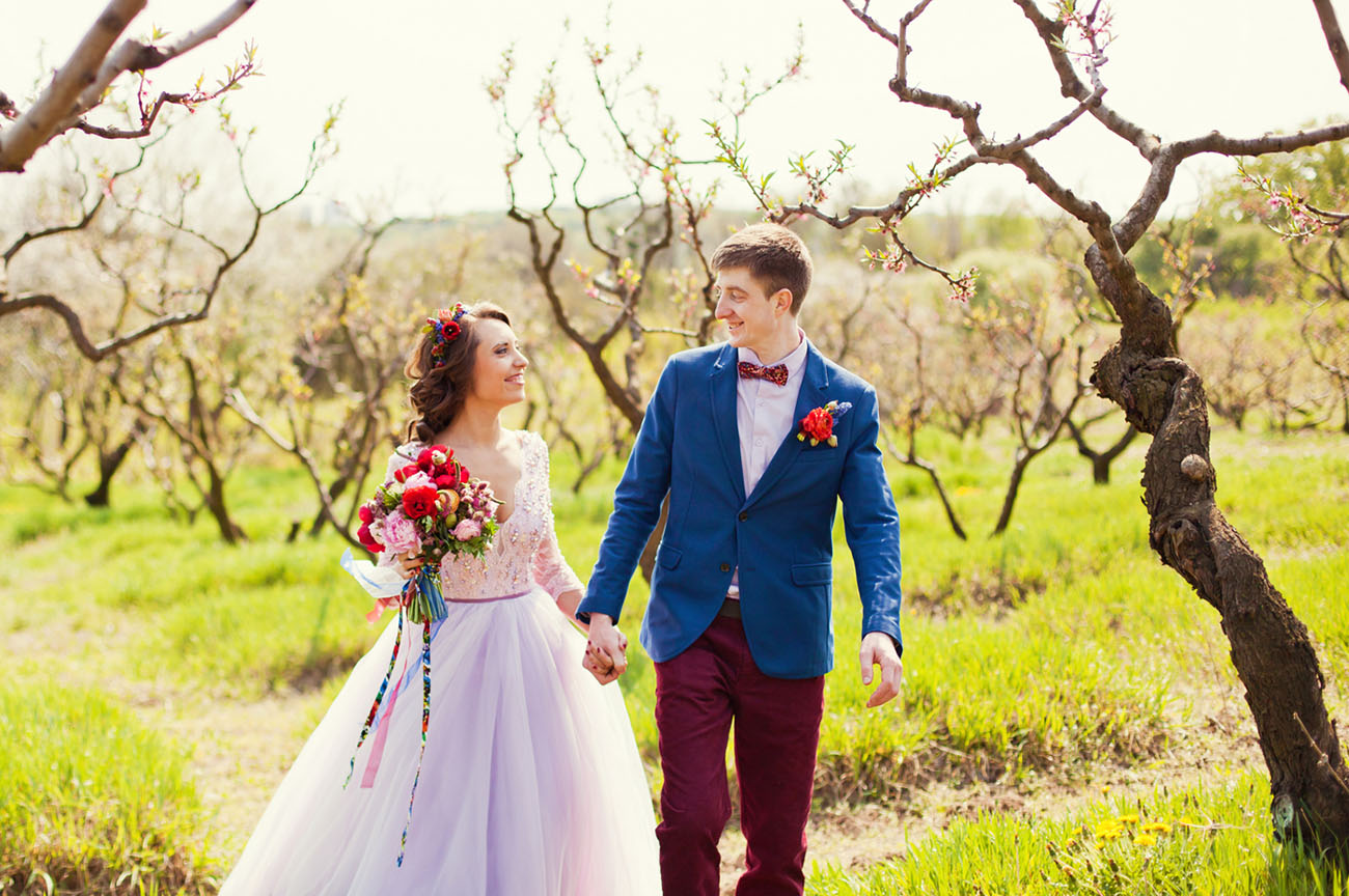 The groom rocked a bold blue jacket, burgundy pants and a bow tie and a white shirt