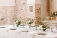 06 The wedding tablescape was done in pastels, with a blush tablecloth and pastel florals