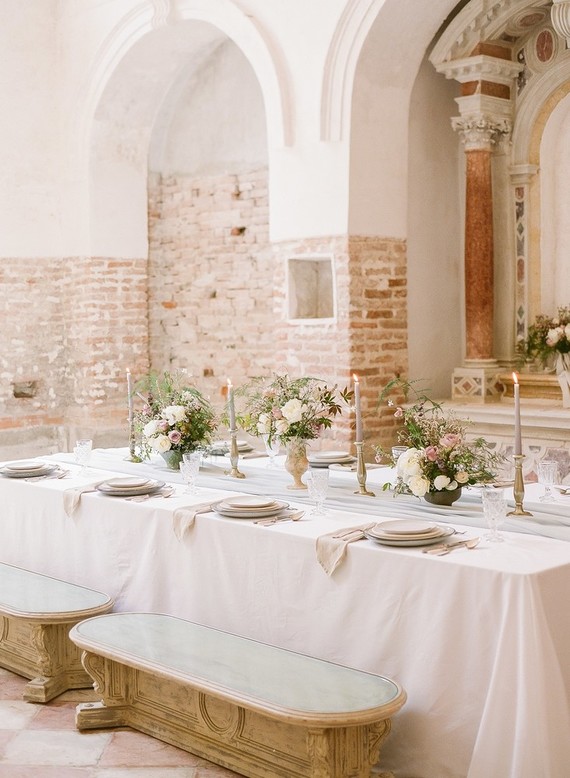 The wedding tablescape was done in pastels, with a blush tablecloth and pastel florals
