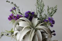 06 a creative bouquet with pale air plants and purple flowers