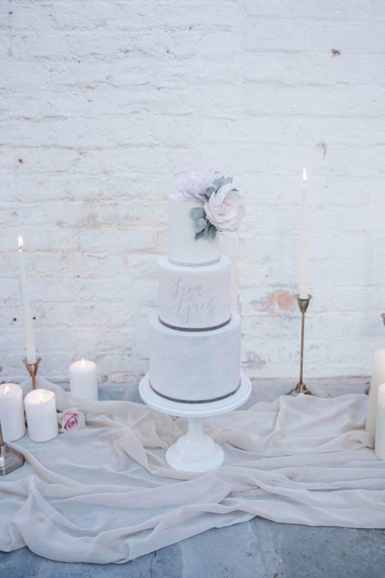 The cake was modern, with light pastel touches, calligraphy and large blooms