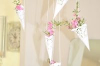 09 paper doilies with fresh blooms hanging from above is a cute decoration
