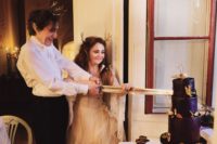10 Cutting a wedding cake with a sword, yes, please