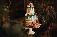 10 The semi naked wedding cake with emerald dripping, macarons and large blooms