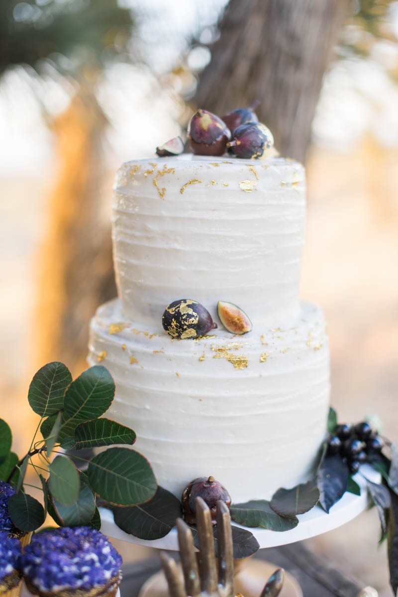 The wedding cake was a gilded one with figs to fit the wedding theme