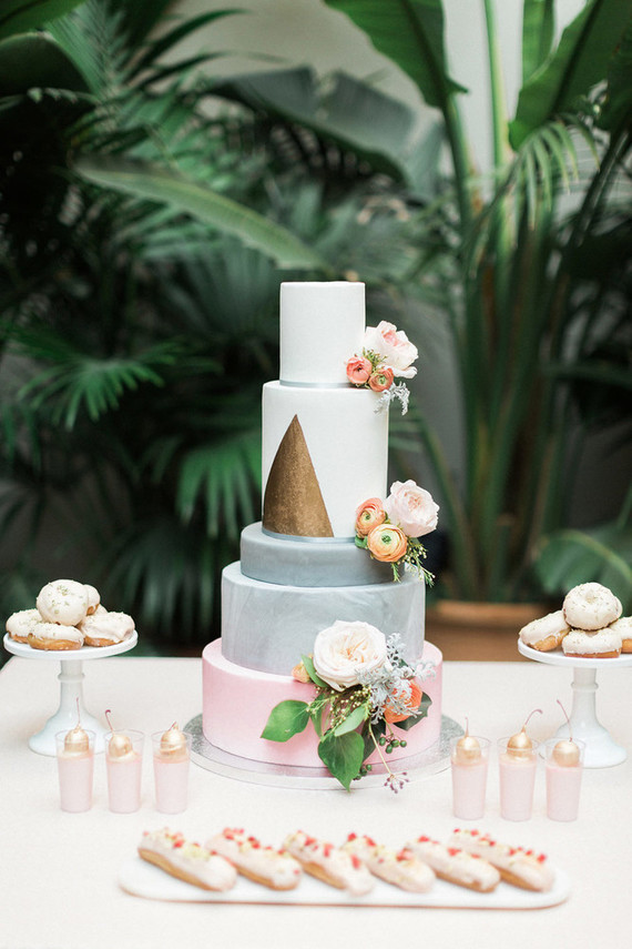 The wedding cake was a multi-tiered one, with marbelized layers and a triangle