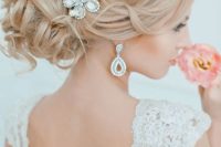 11 curly messy updo with a cool beaded headpiece  and matching earrings