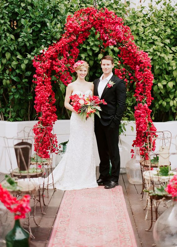 hot red floral wedding arch is a great choice to embrace the season