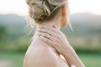 12 a soft and messy bridal updo looks chic and doesn’t require much effort to make