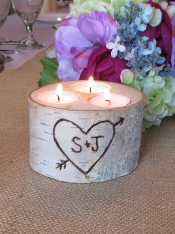a birch bark log with candles for table decor