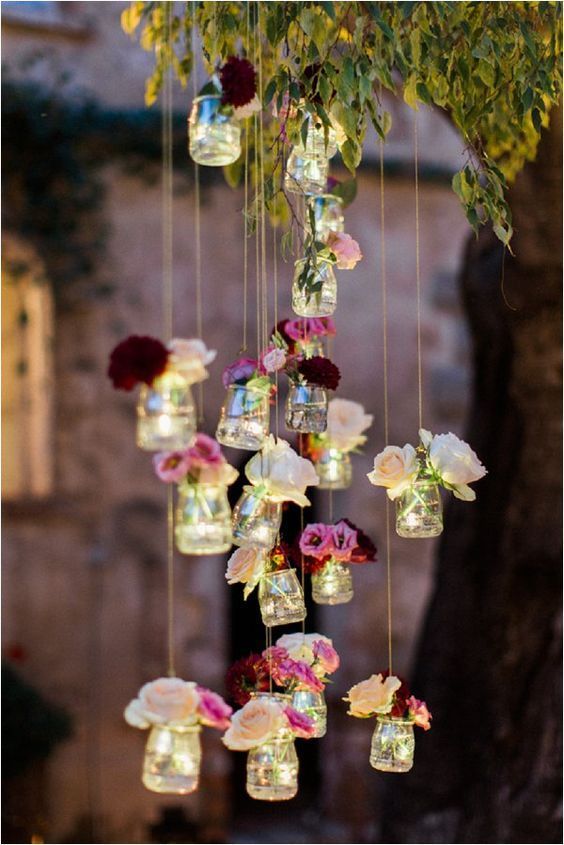 hanging mason jars with red and pink flowers