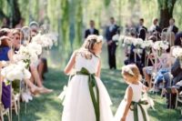 17 accentuate the white midi dresses with some bold sashes and bows