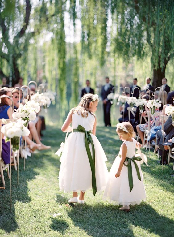 accentuate the white midi dresses with some bold sashes and bows