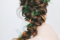 18 a twisted braid with greenery tucked in instead of flowers