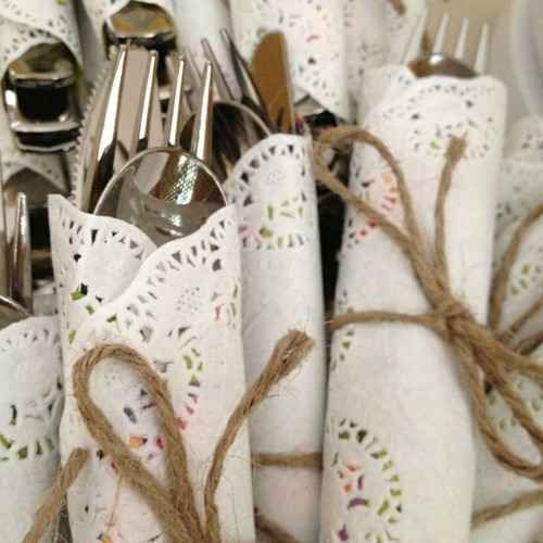 paper doilies and twine for wrapping the cutlery is a great rustic idea