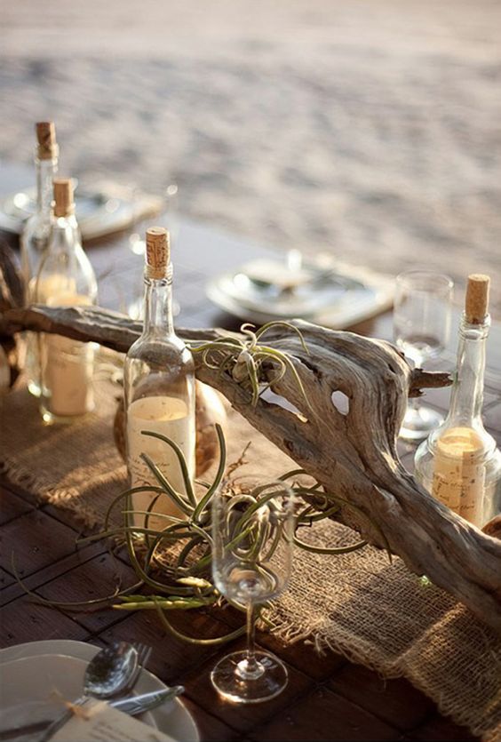 a piece of driftwood with airplants for a beach tablescape