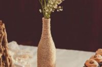 19 a twine wrapped bottle with baby’s breath and LOVE letters