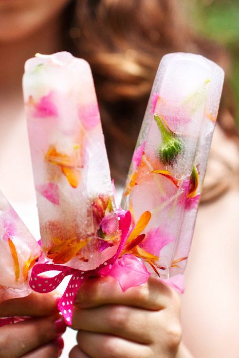 popsicles with colourful edible flowers make a cool summer treat