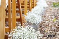 21 a bucket with baby’s breath for a rustic summer aisle
