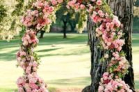 21 pink flower wedding arch is ideal for a garden ceremony