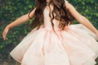 22 a blush dress with a big ruffled skirt and neutral flats