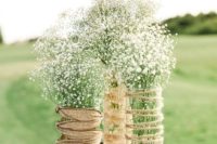 22 burlap and twine wrapped jars and vases with baby’s breath