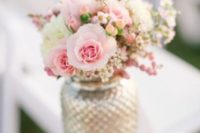 22 gilded mason jar with a delicate pink flower arrangement