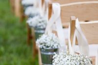 23 buckets on ribbon with baby’s breath for a rustic wedding aisle