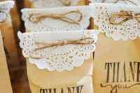 23 coffee bean bags covered with doilies and twine
