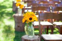 24 wooden logs with sunflowers in mason jars
