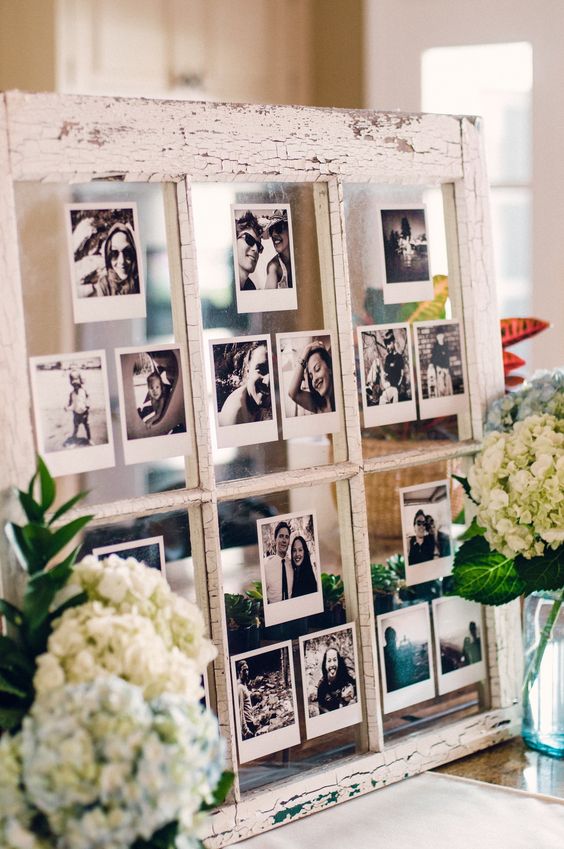 an old window turned into a photo display is a great idea for crafters