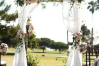25 sweet birch arch with flowy fabric, pastel florals and greenery