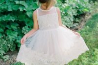 26 creamy sleeveless crochet lace dress with a trim on the skirt