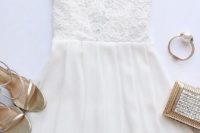 26 white dress with a lace bodice and short sleeves, metallic accessories