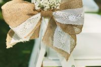 27 a burlap and lace bow with baby’s breath is a cool and simple idea