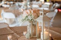 27 a white lantern with candles, a mason jar with burlap and lace, white blooms