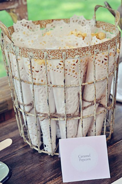 caramel corn wrapped in white paper doilies