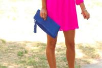 28 hot pink mini dress with sleeves, nude heels and a blue clutch