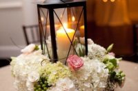 29 a wooden box with fresh flowers and a black candle lantern