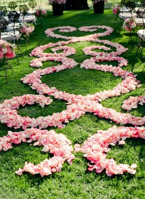bold pink petals and bold flower decor on the chairs