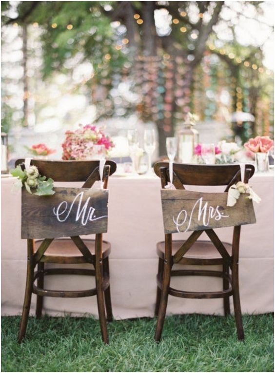 wooden signs and floral posies for chair decor