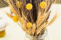 wheat, lavender and craspedia arrangement in a jar won’t break the bank and will add a rustic touch to the space