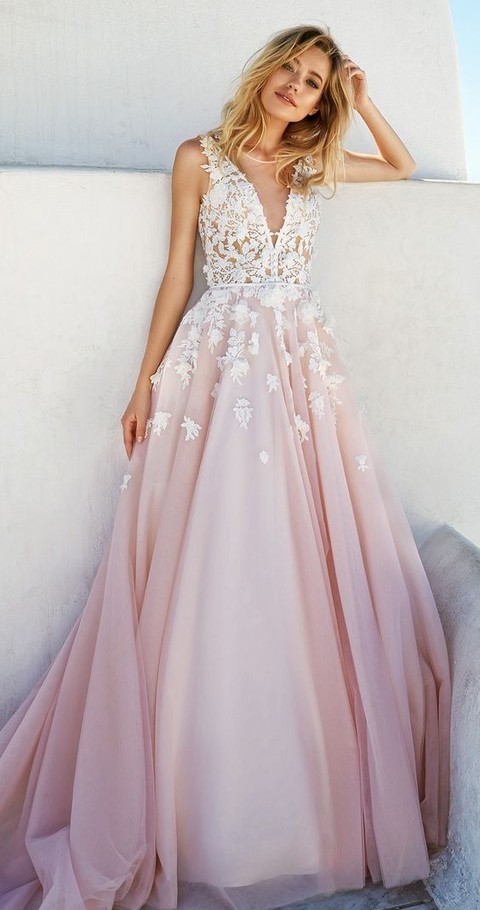 a floral applique wedding dress with a plunging neckline and a pink skirt